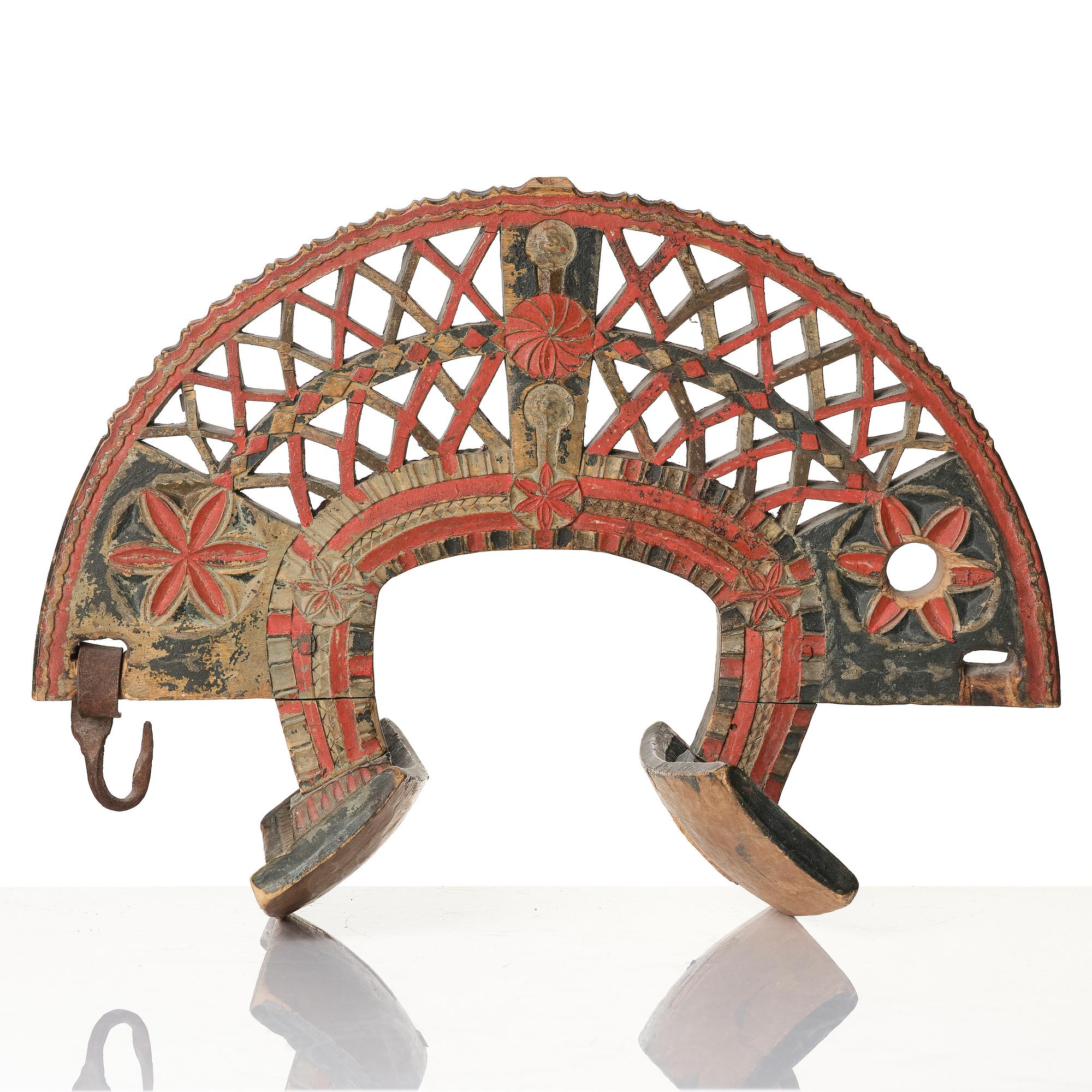 A Swedish folk art carved and polychrome-painted part horse harness, Uppland, dated 1774.