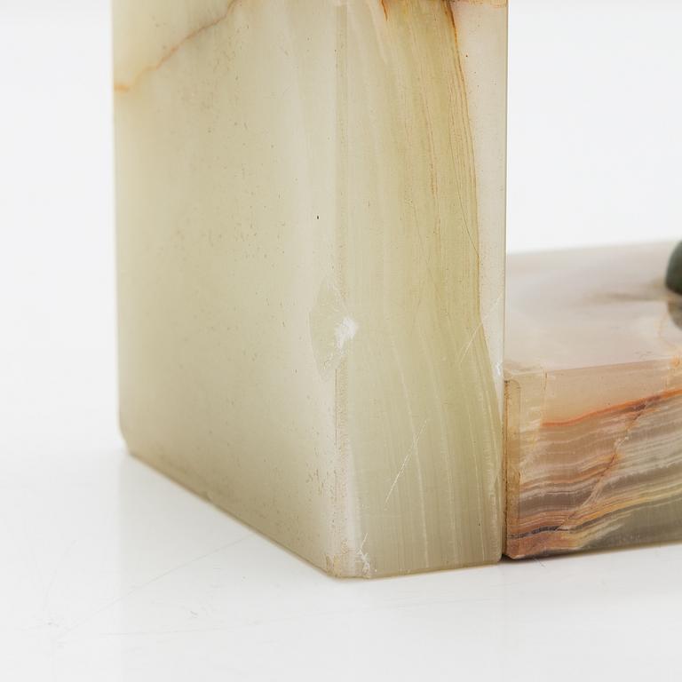 A pair of alabaster and  patinated metal Art Deco bookends from the first half of the 20th Century.
