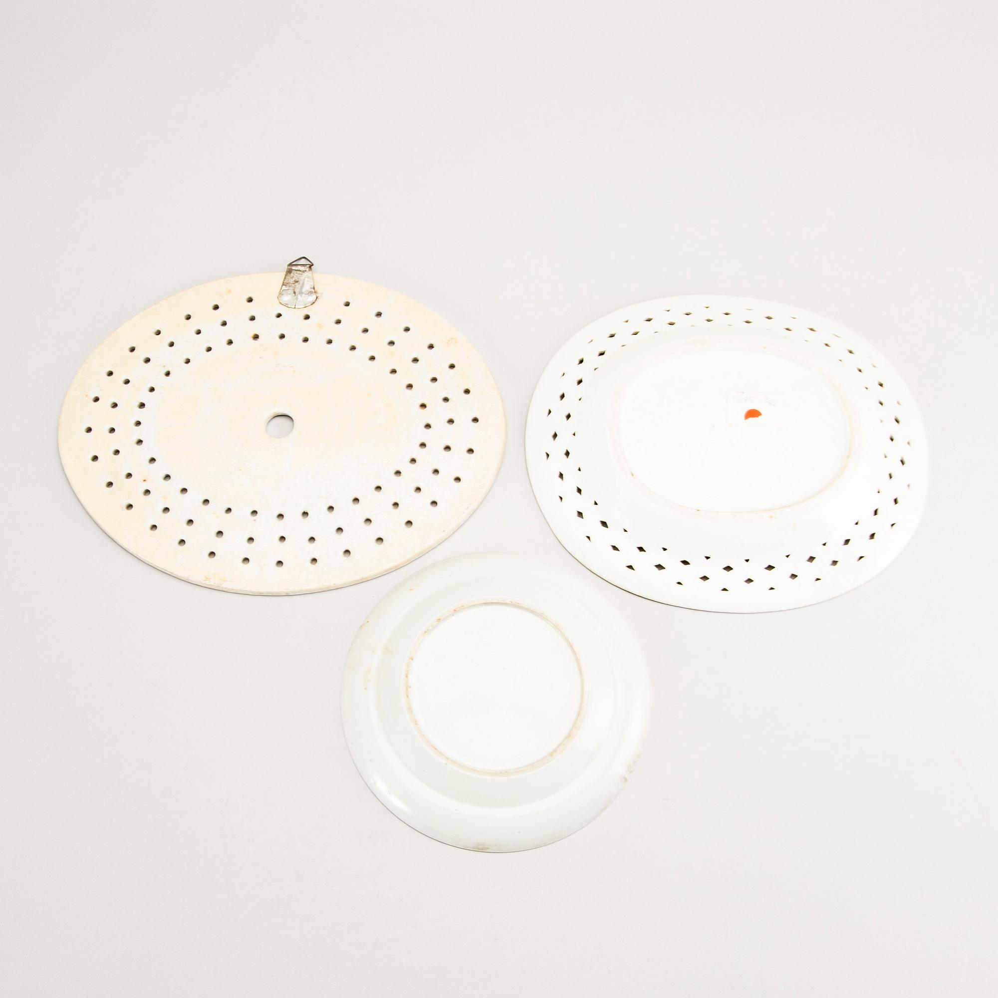 A set of two Chinese blue and white 18th century plates and strainer.