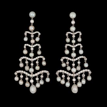 944. A pair of natural saltwater pearl and diamond earrings. Total carat weight on diamonds circa 2.30 cts.