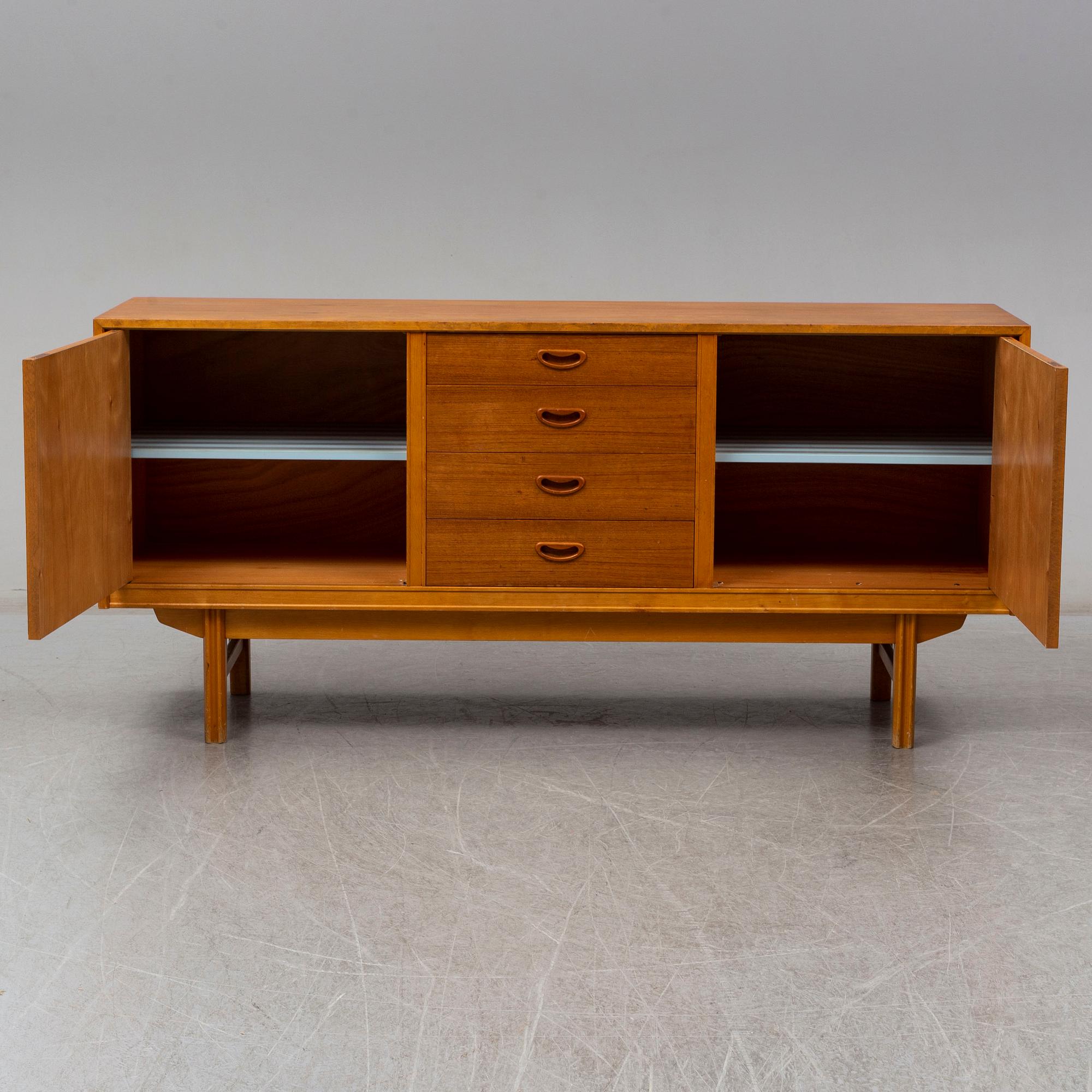 A 1950/60s teak veneered sideboard.