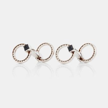 MANCHETTKNAPPAR med briljantslipade diamanter och onyx.