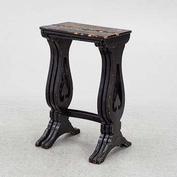 A lacquered nesting table, around 1900.