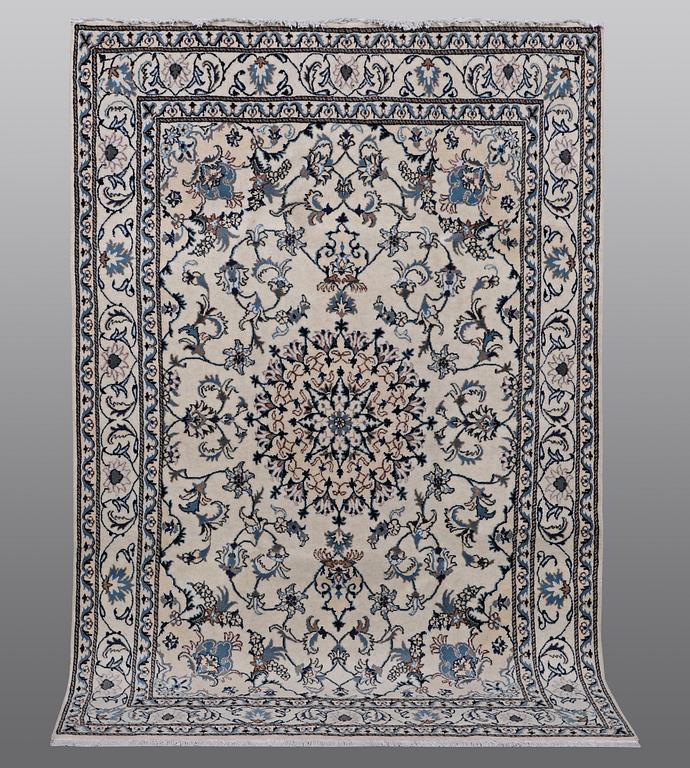 A rug, Nain, part silk, 238 x 163 cm.