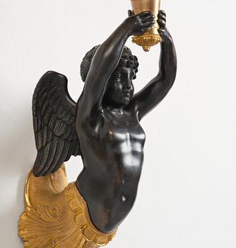 A pair of Napoleon III five-branch gilt and patinated bronze appliques.