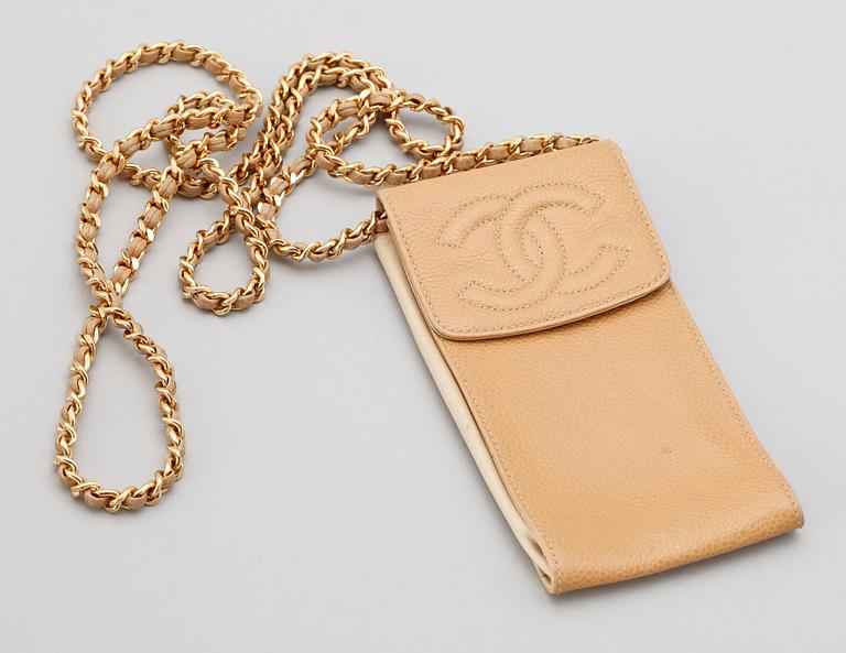 A beige leather case by Chanel.