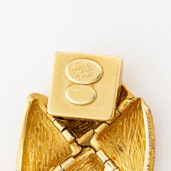 An 18K gold bracelet by Henry Dunay.