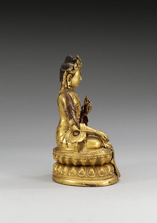 A gilt copper figure of Buddha, late Qing dynasty, 19th Century.