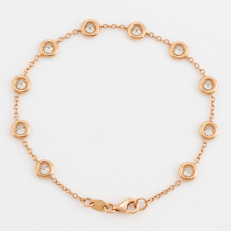 An 18K rose gold bracelet set with round brilliant-cut diamonds.