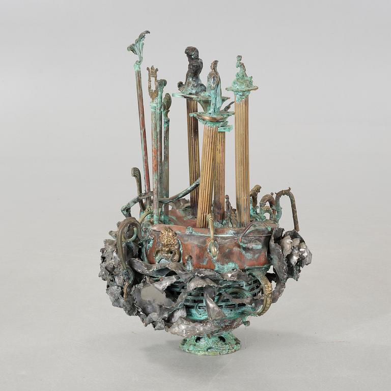 a metal sculpture, signed and dated 1980.