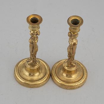 A pair of late Gustavian bronze candlesticks, early 19th century.