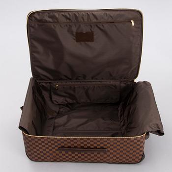 LOUIS VUITTON Damier Ebene Brown Pégase Suitcase with protective cover.