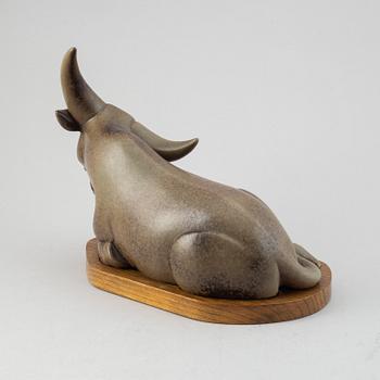 Gunnar Nylund, a stoneware sculpture of a reclining buffalo, Rörstrand, number 16/200.