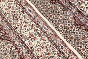 A part silk Moud carpet, approximately 350 x 252 cm.