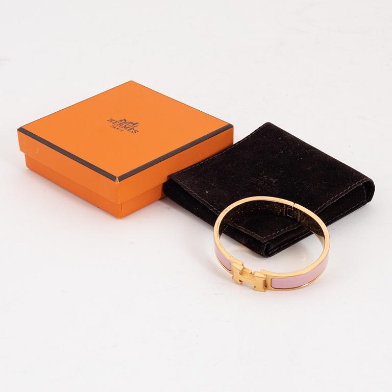 Hermès, a 'Clic H PM' bracelet.