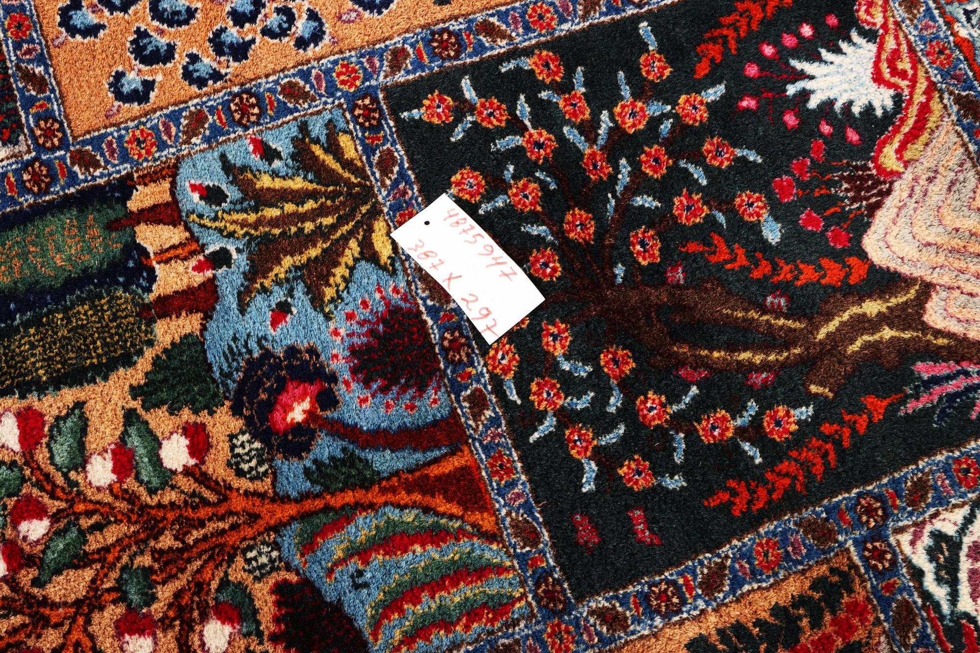 A Kashmar carpet, c. 387 x 297 cm.