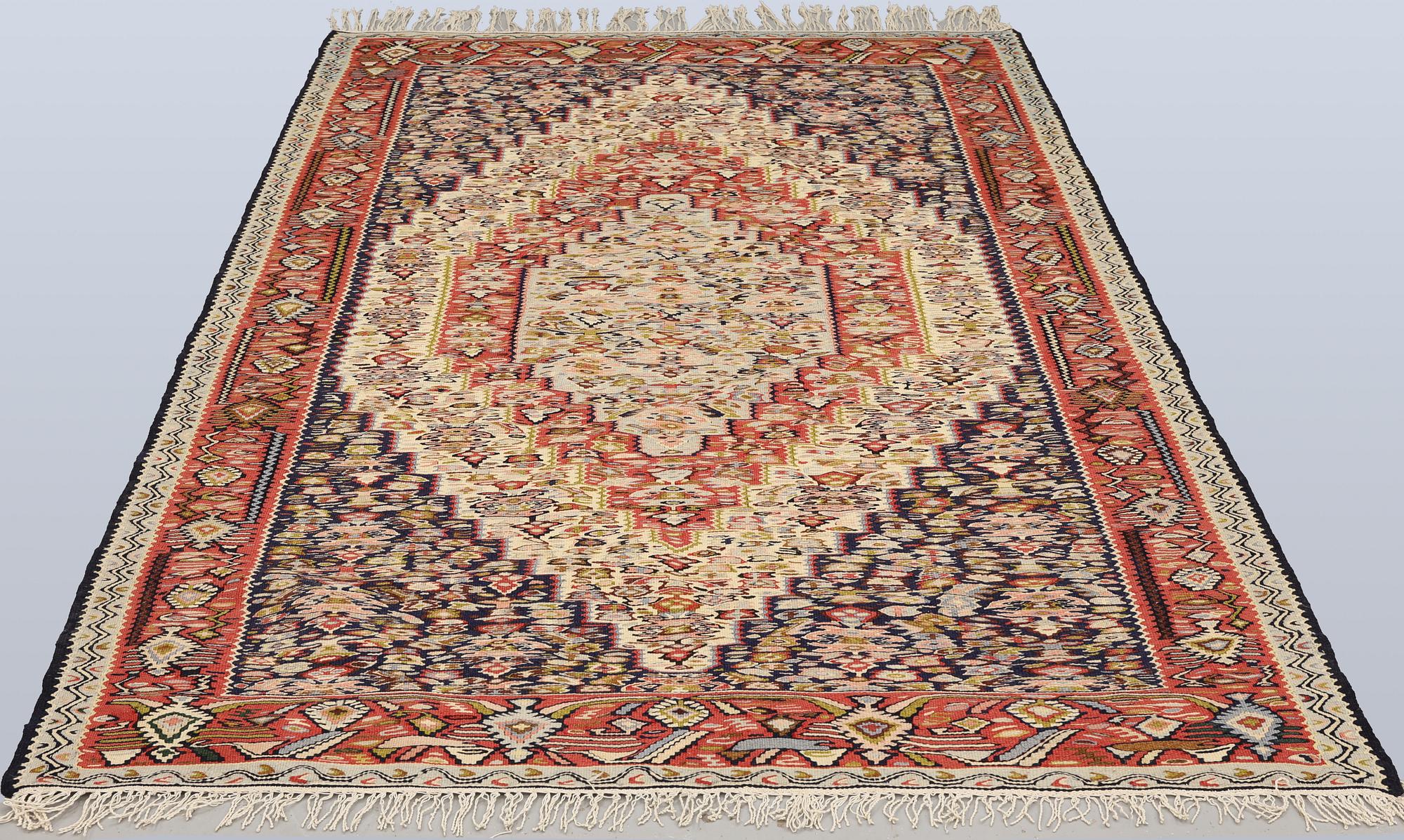 A semi-antique Kilim rug, Senneh, c. 230 x 147 cm.