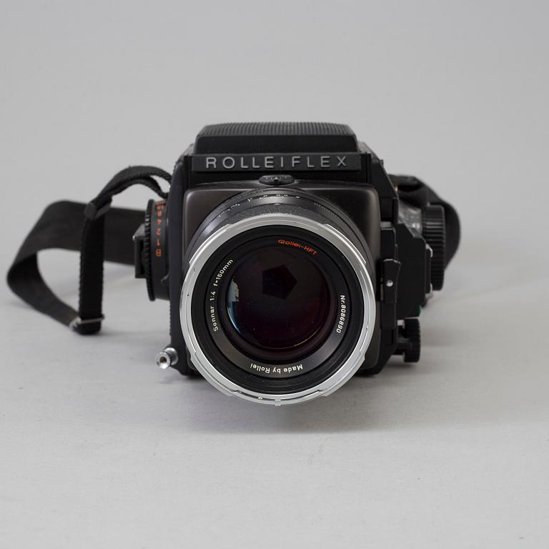 A Rolleiflex SL 66 E camera no 902510006 with three lenses.