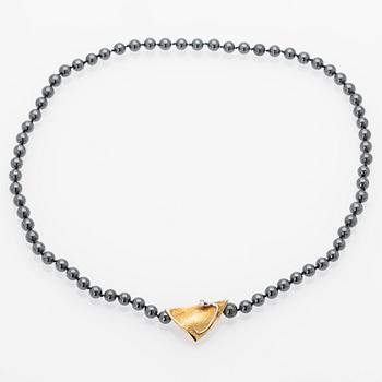 Ole Lynggaard, Hematite necklace with an 18K gold clasp and a diamond.
