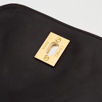 Chanel, a brown suede and leather one strap backpack/sholder bag, 1991-1994.