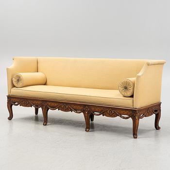 A carved Rococo sofa, 18th Century.