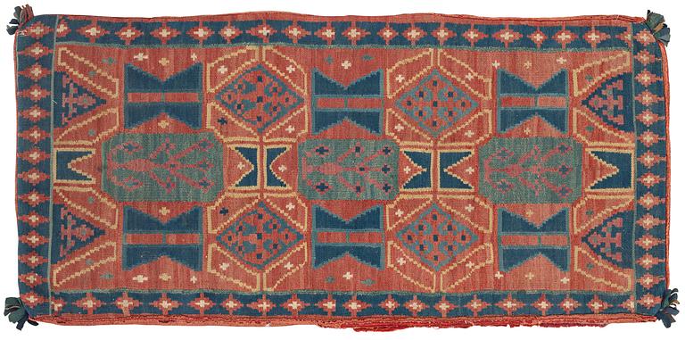 A carriage cushion, double-interlocked tapestry, c. 102 x 48 cm, Scania, Sweden, last quarter of the 18th century.