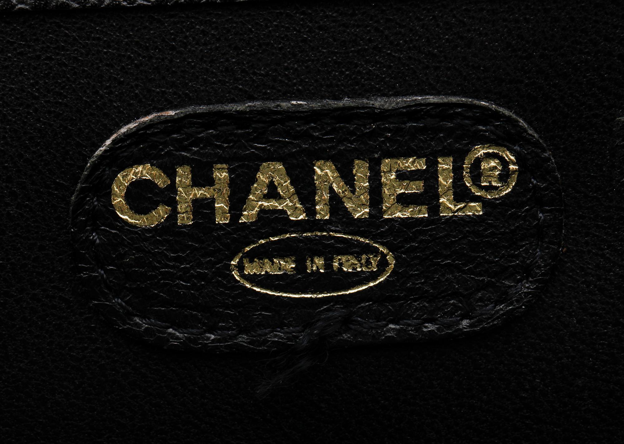 A 21th cent black "caviar" leather beautybox/weekendbag by Chanel.