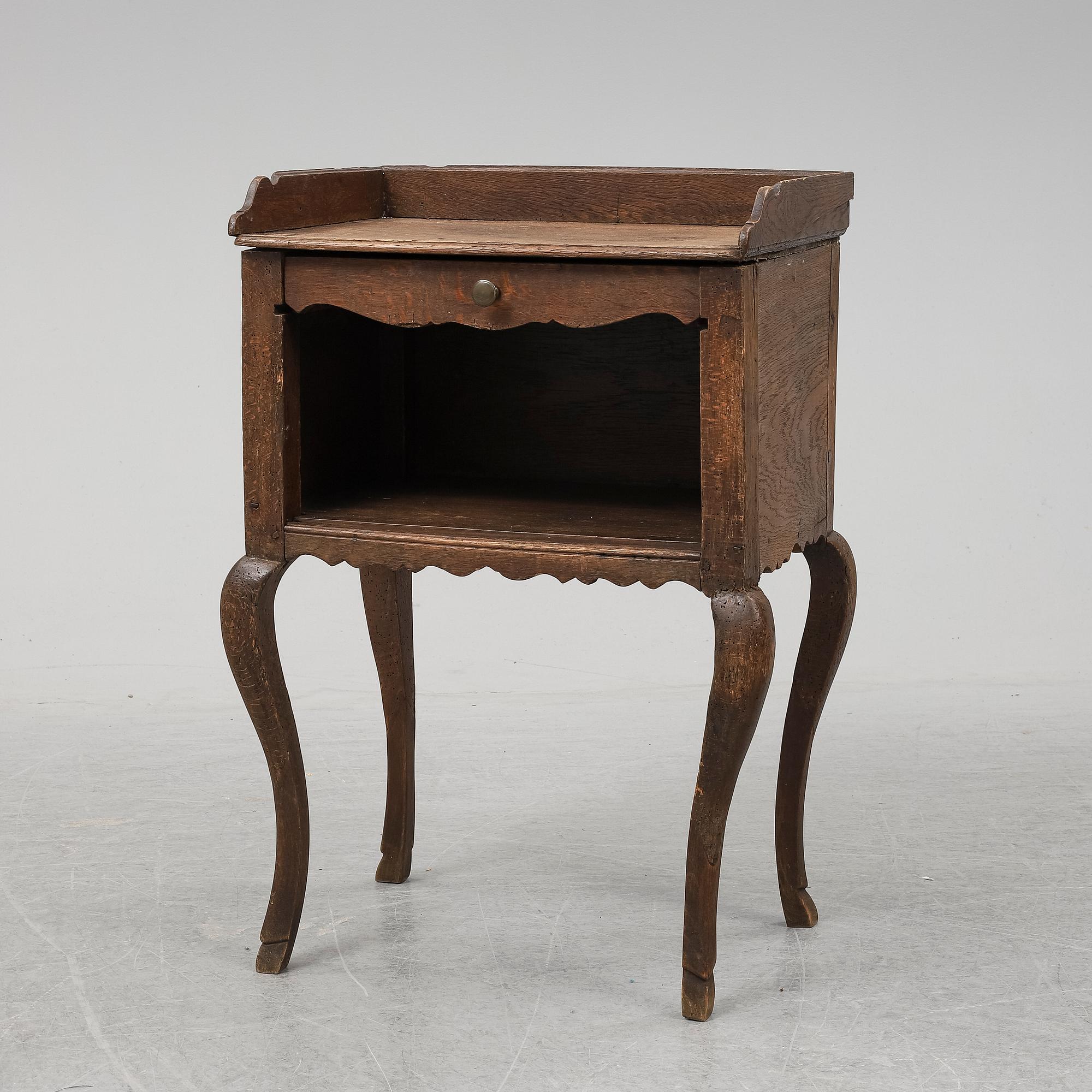 A mid 18th Century oak rococo bedside table.