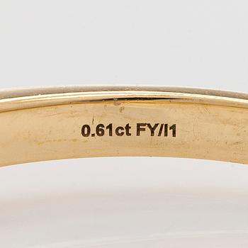 Ring in 18K gold, with a cushion-cut yellow diamond.