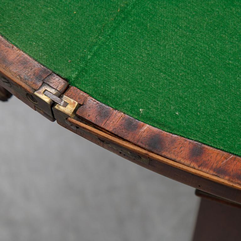 A pair of George III demi-lune mahogany card tables, first half of the 19th Century.