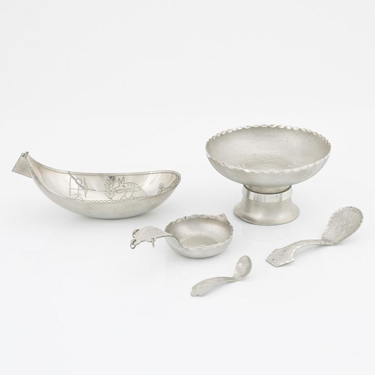 Four pewter bowls and a tray.