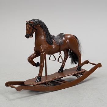 A painted rocking horse from around 1900.