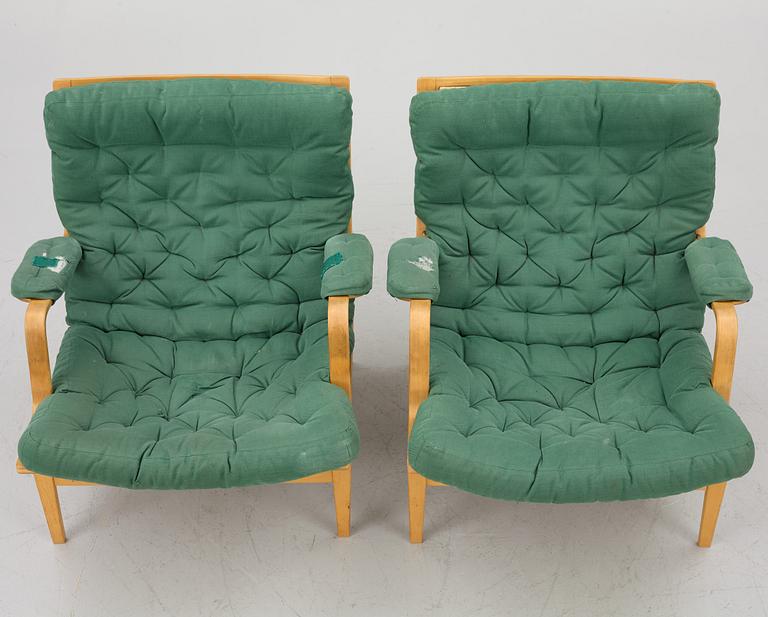 Bruno Mathsson, a pair of "Ingrid" armchairs, Dux, Sweden, second half of the 20th century.
