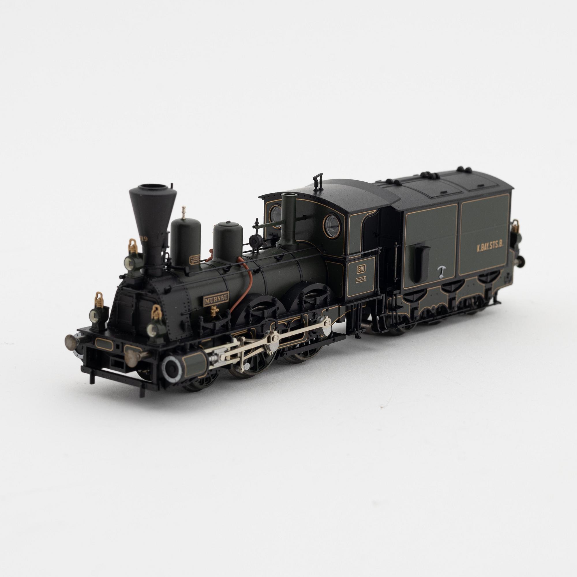 Märklin, a steam locomotive 3497 and car set no 4897, in boxes.