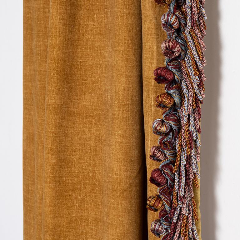A pair of yellow velvet curtains from Brochier Como.