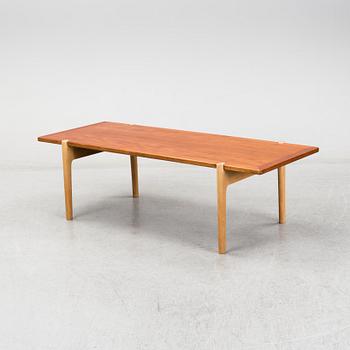 A model JH 575 coffee table by Hans J Wegner for Johannes Hansen.