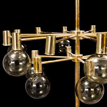 A 20th century brass and smoked glass chandelier by Hans Agne Jakobsson, Markaryd, Sweden.