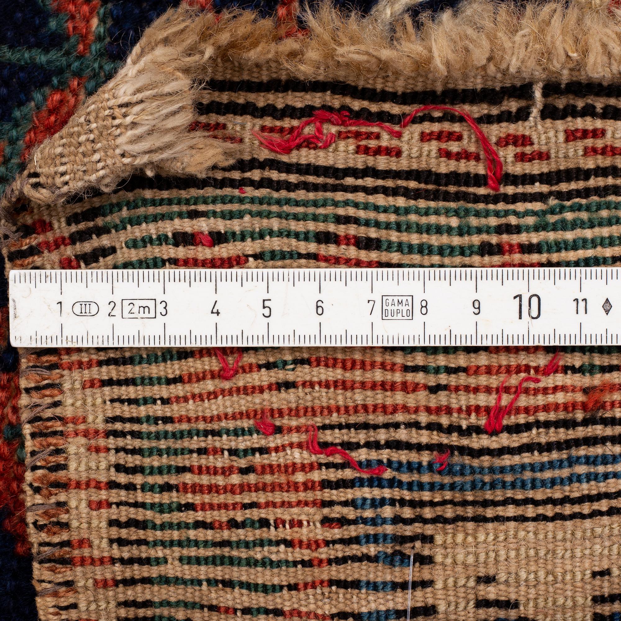 A antique Kazak gallery carpet, ca 310 x 105 cm.