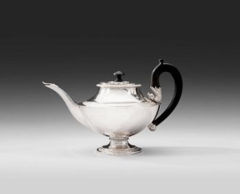 A TEA POT.