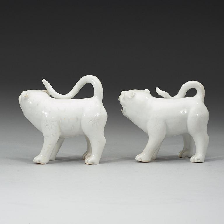 A set of two blanc de chine mythological animals, late Qing dynasty.