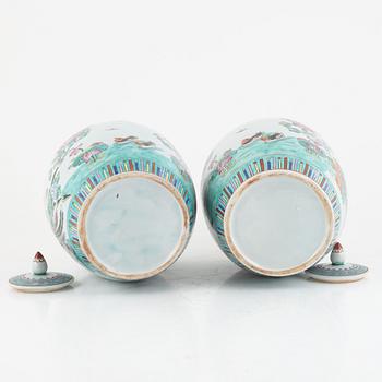 A pair of Famille rose porcelain urns, 20th century.