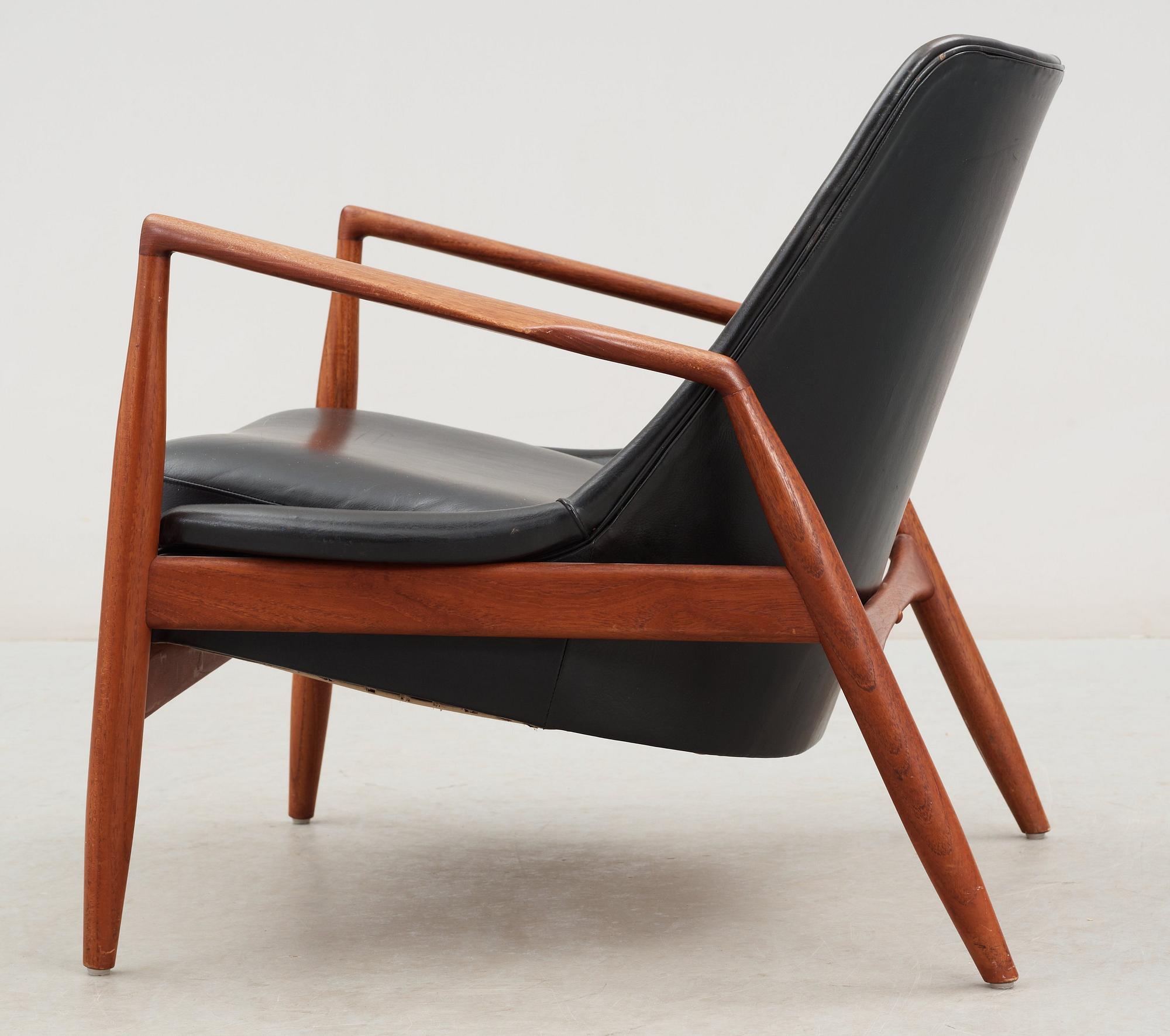 An Ib Kofod Larsen black leather and teak easy chair 'The Seal' by OPE, Sweden 1950-60's.