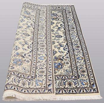 A rug, Nain part silk, ca 235 x 160 cm.