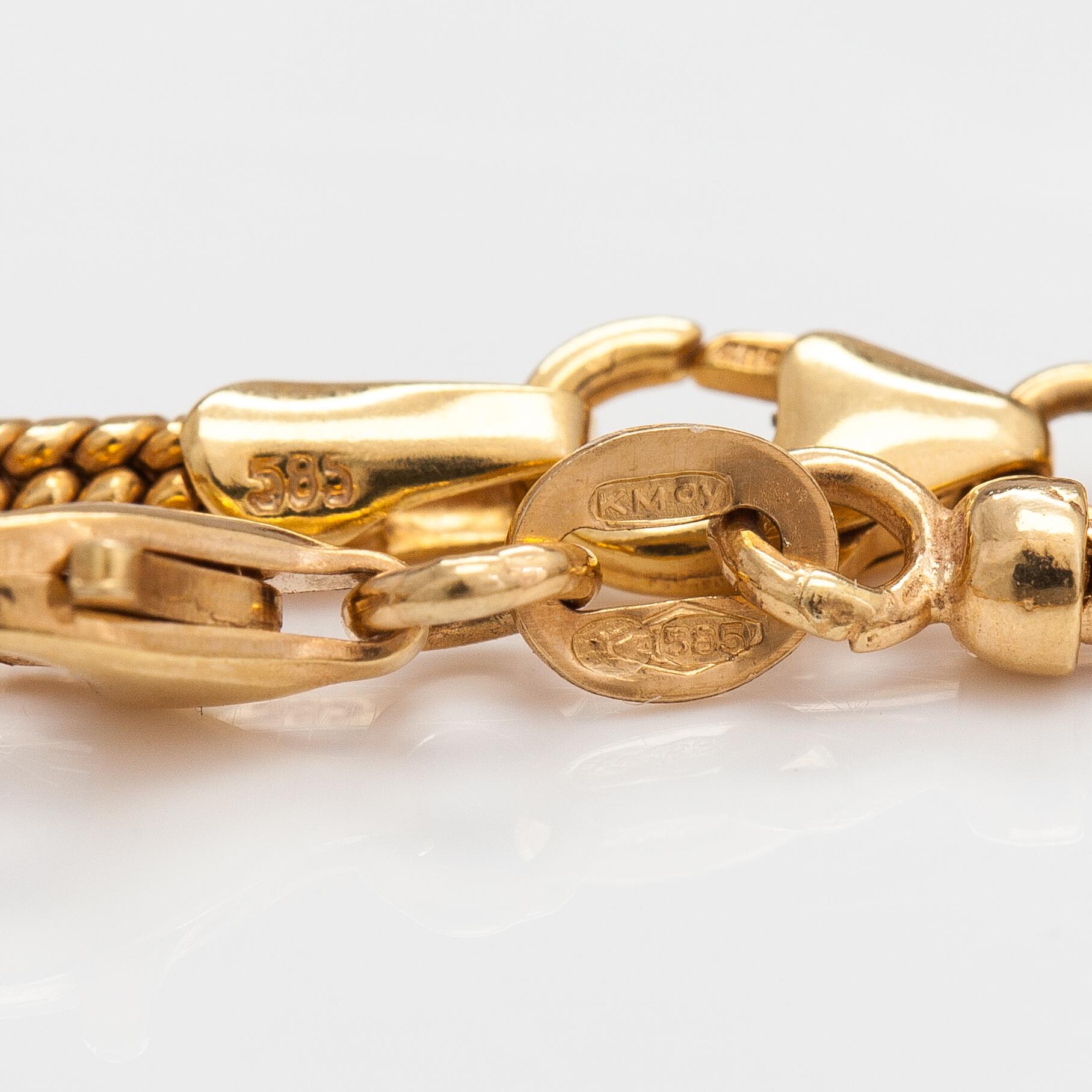 A 14K gold necklace and bracelet with a cultured pearl.