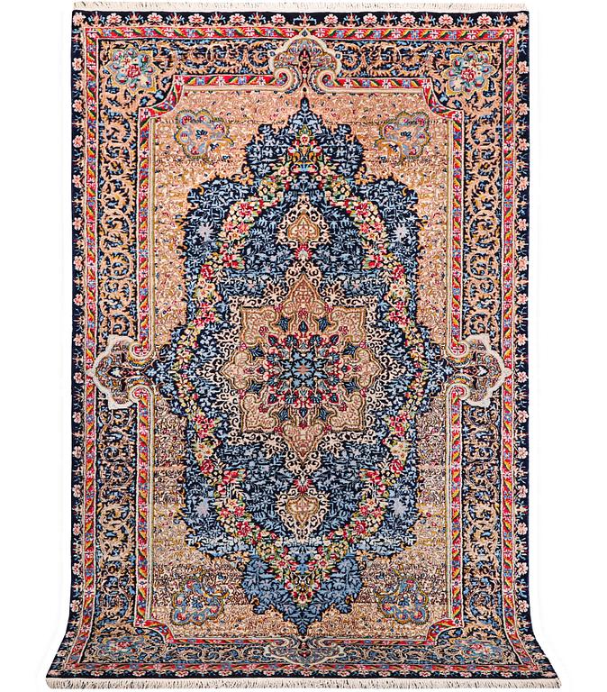 A Kerman Laver carpet, c. 252 x 150 cm.