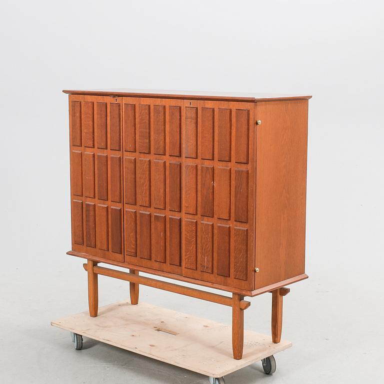 An Eyvind Beckman  a 1940s oak cabinet.