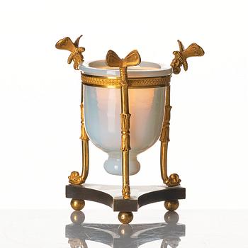 An Empire tripod with an opalin glass bowl, first part of the 19th century.