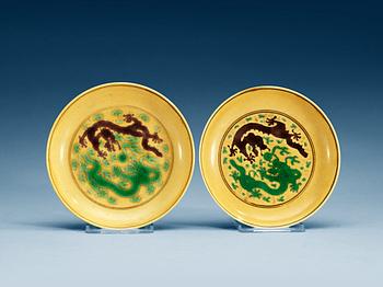 1512. Two yellow ground dishes, Qing dynasty with Jiaqing sealmark (1796-1820) and Daoguangs sealmark and period (1821-1850).