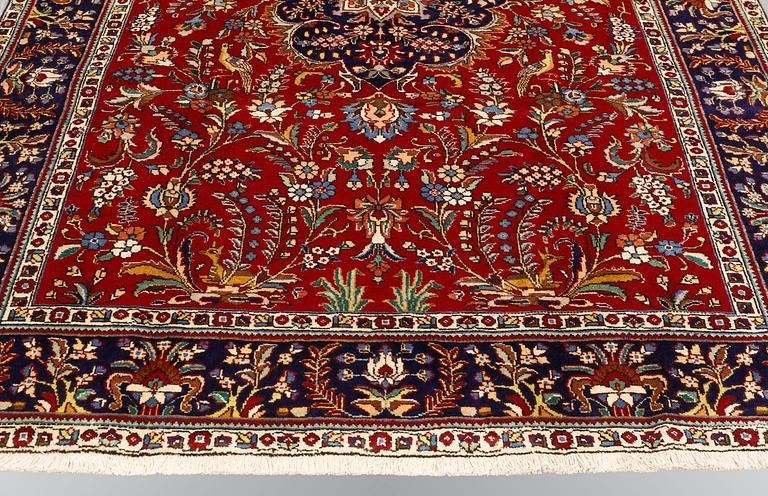 A carpet, Figural Tabriz, ca 310 x 220 cm.