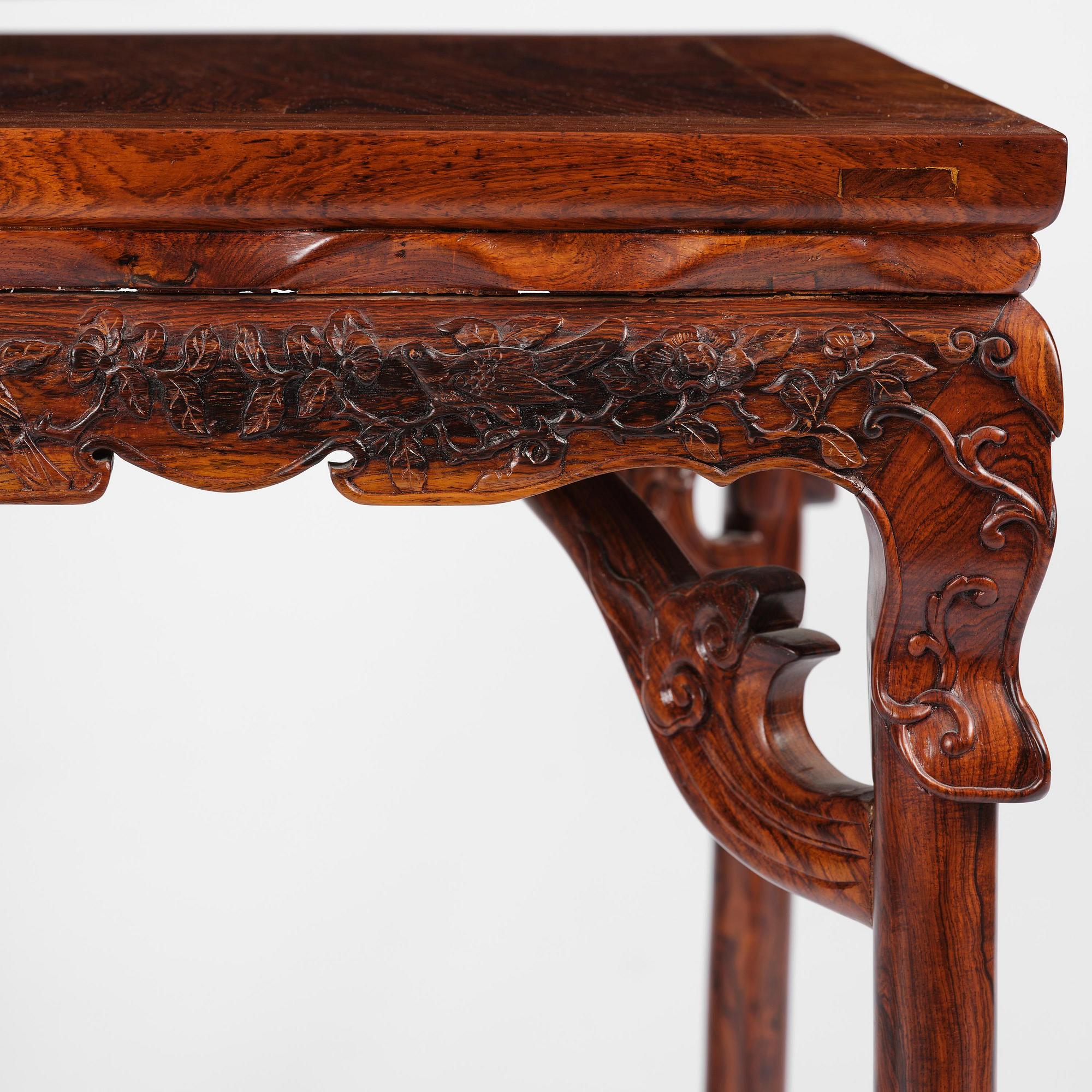A Chinese huali square table with a lotus-leaf waist, 20th century.